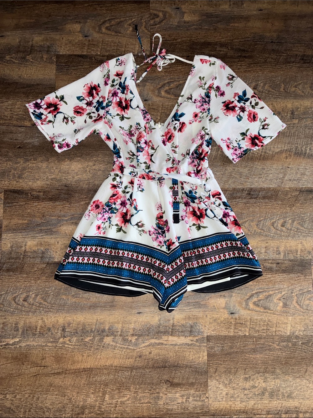 Francesca's Collections White Floral Romper with Pink & Blue Accents
